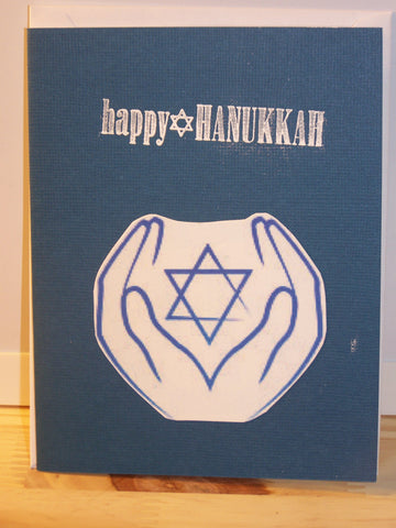 blue "Happy Hanukkah" card w/outline hands & star
